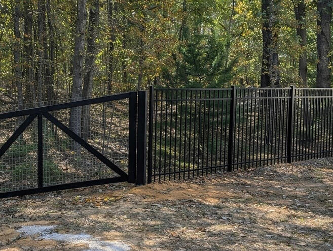 Ornamental Aluminum Fence with Wire Mesh Backing. Ornamental Aluminum Fence with Wire Mesh Backing.